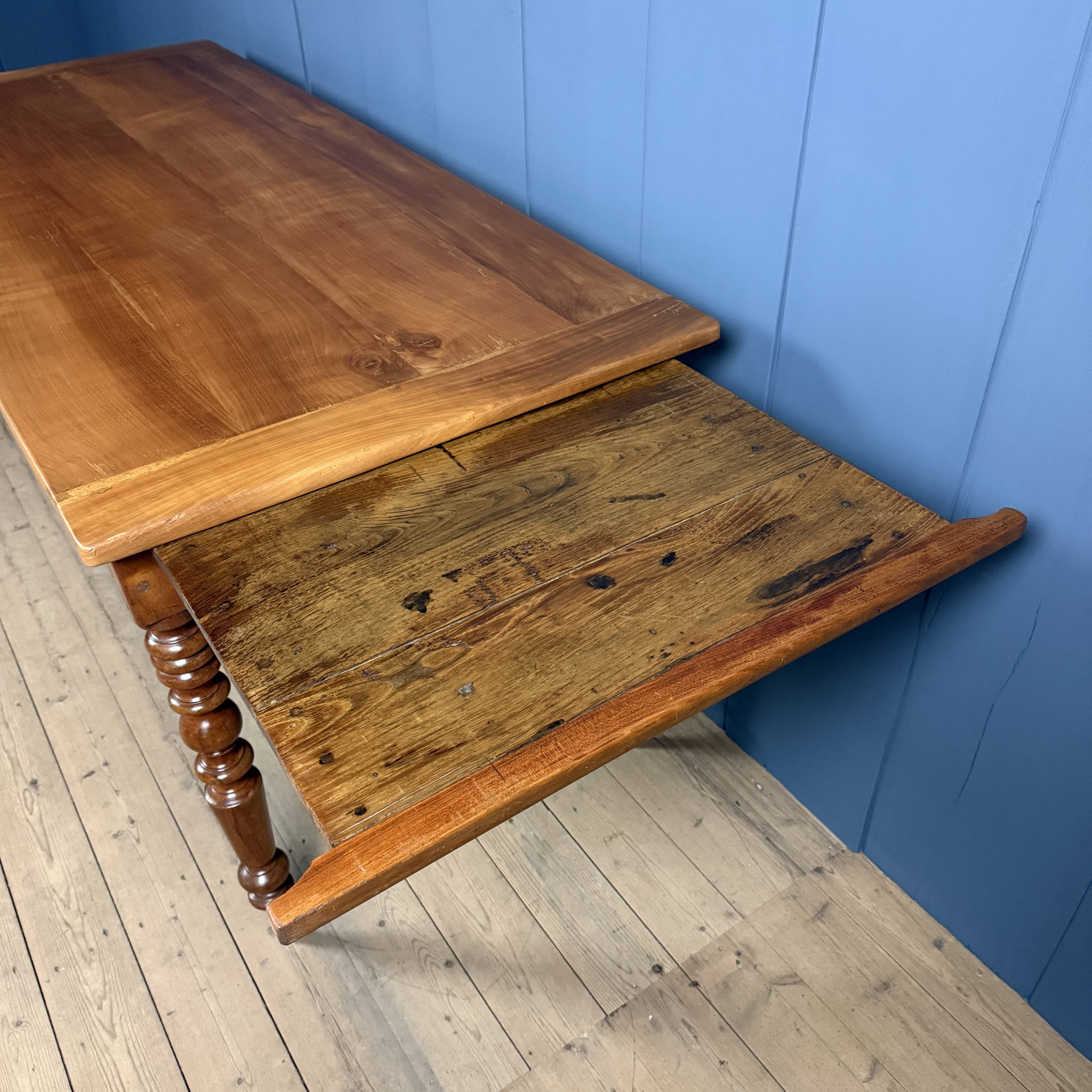Antique cherry wood dining table from France.