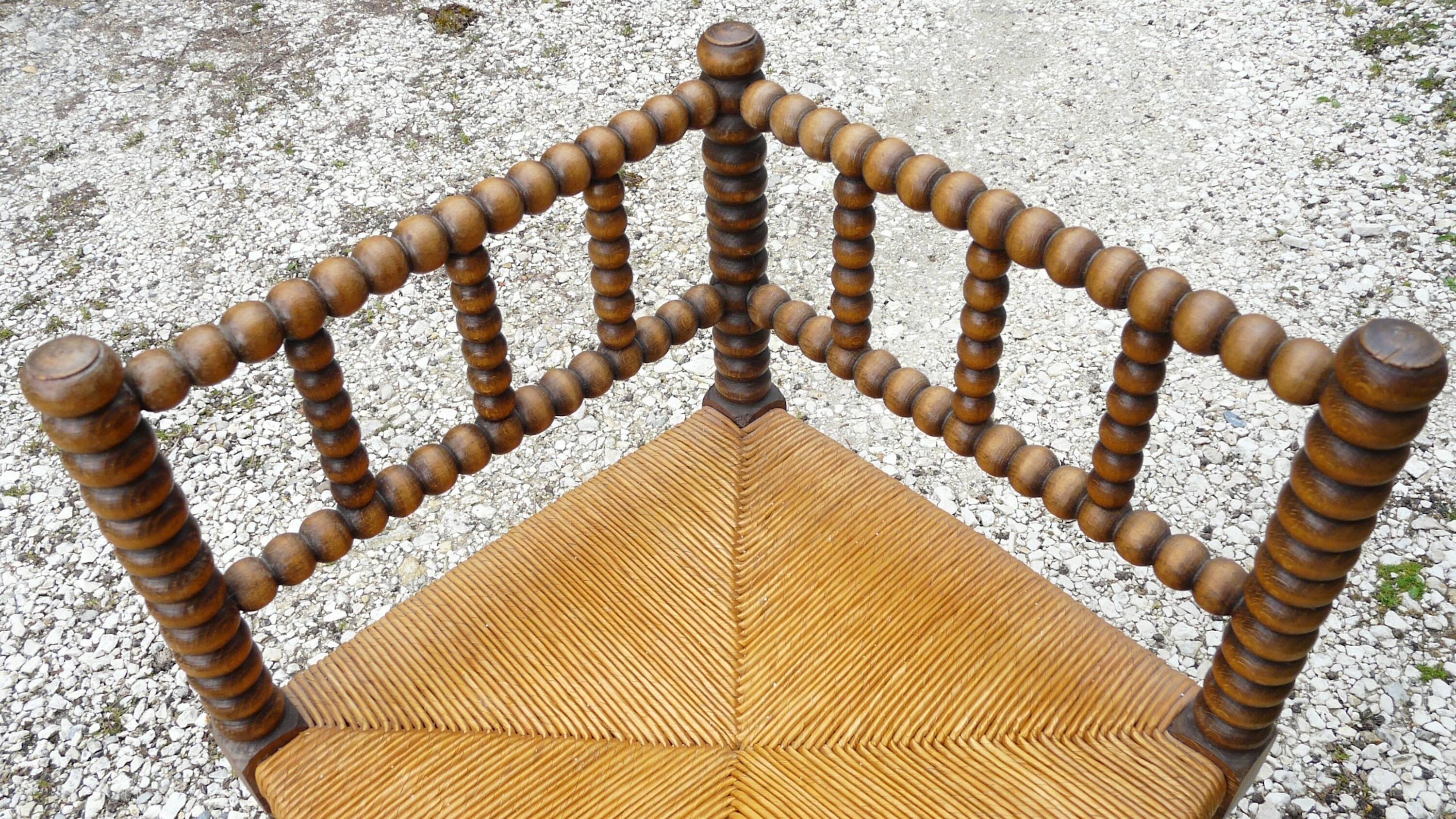 Turned wood straw corner armchair