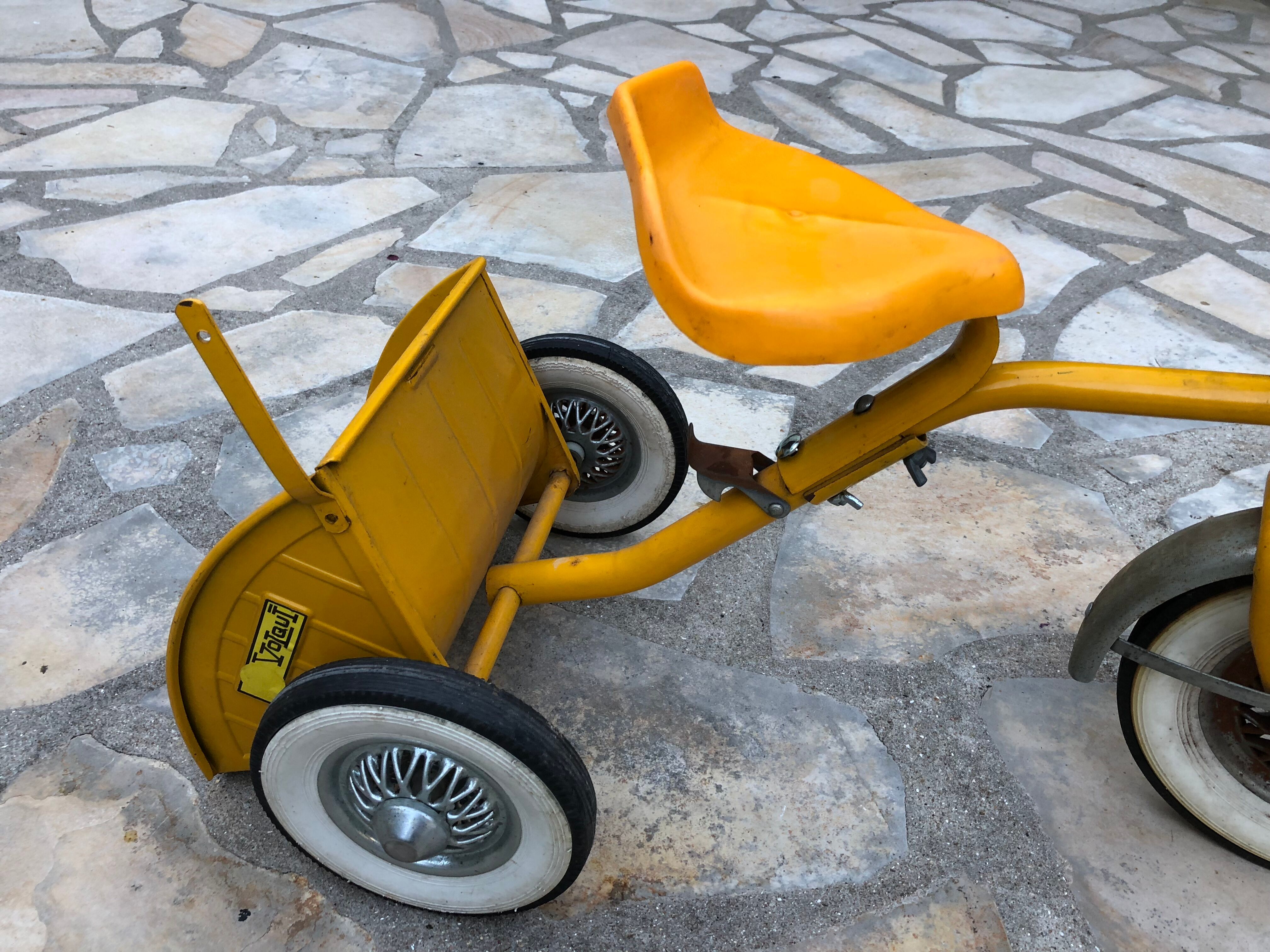 Yellow tricycle with folding bucket