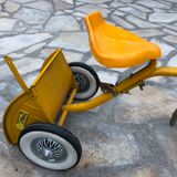 Yellow tricycle with folding bucket