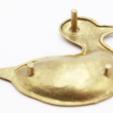 Empty brass duck pocket