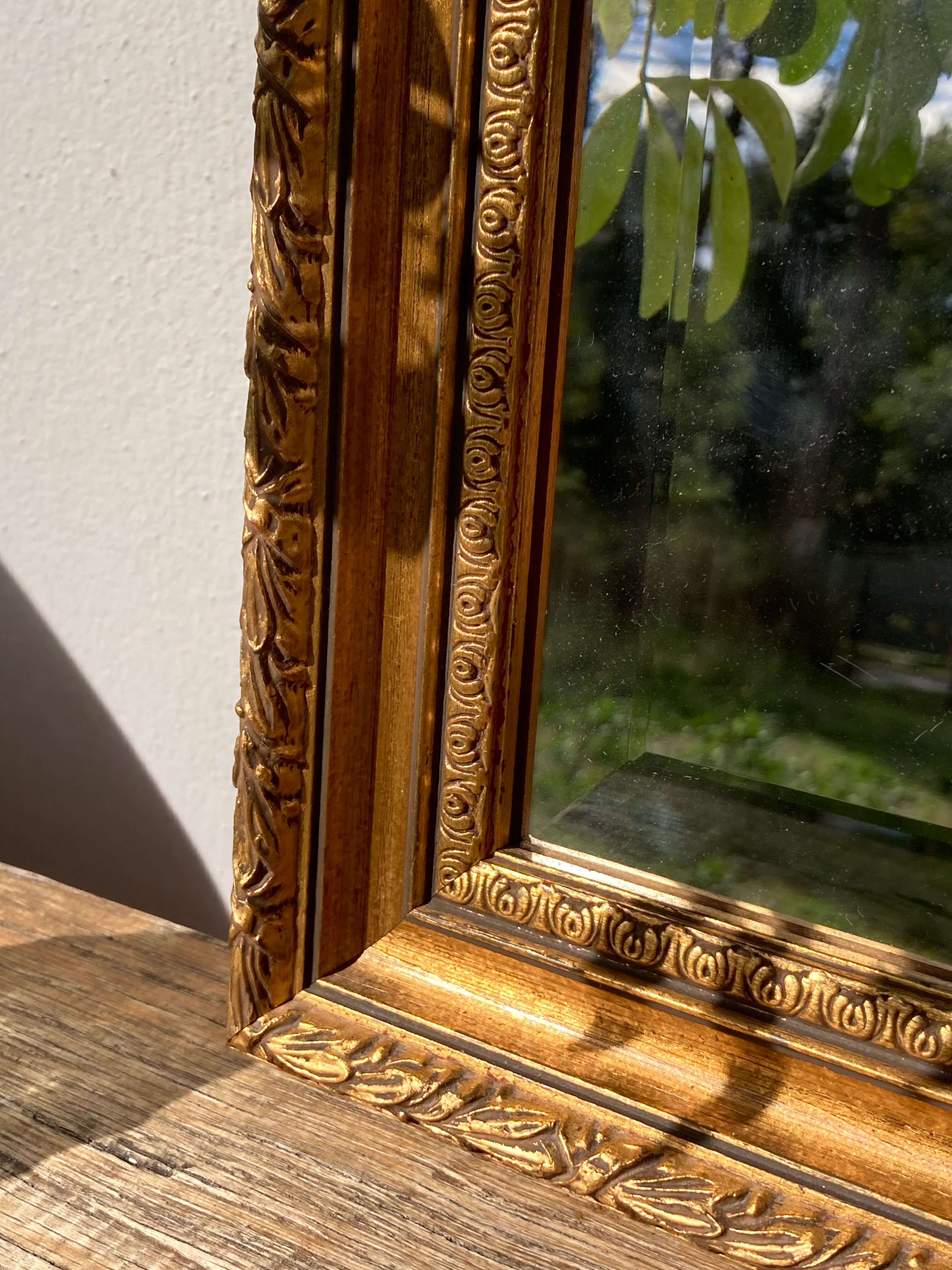 Antique mirror in rectangular beveled gilded wood in Louis XVI style