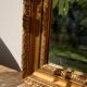 Antique mirror in rectangular beveled gilded wood in Louis XVI style