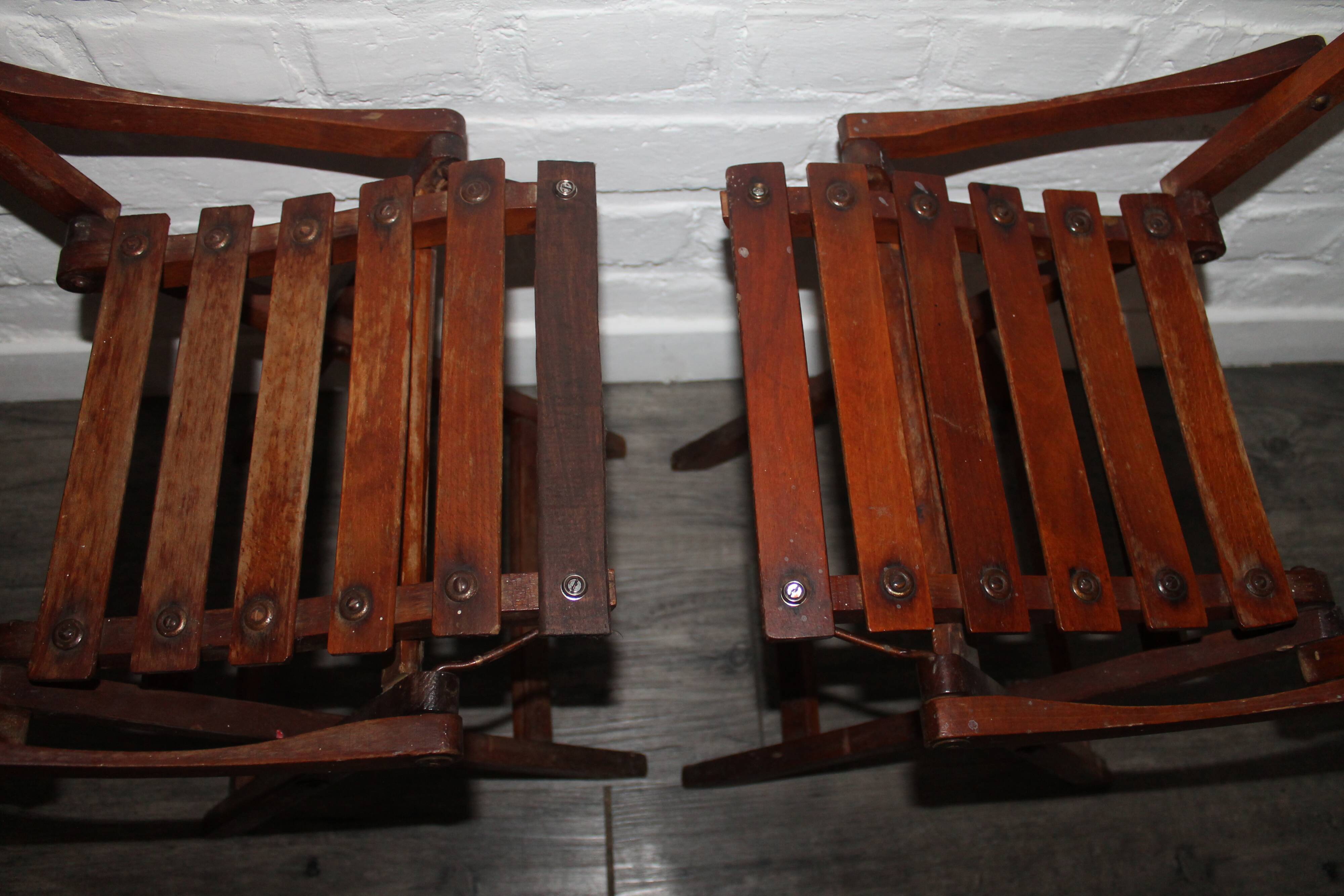 2 wooden folding chairs