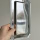 Small rectangular tray made of lightweight metal.