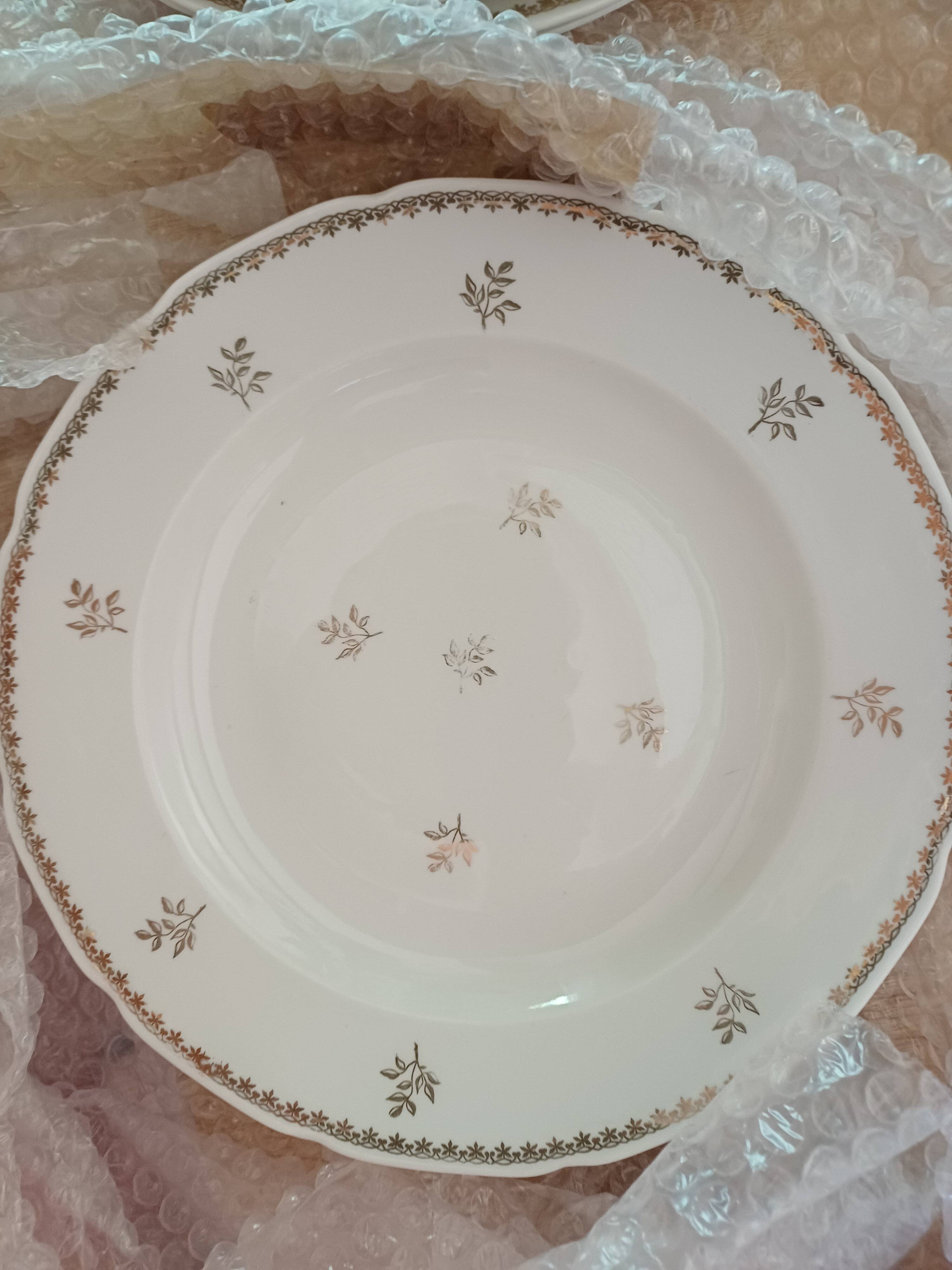 A lot of old white and gold porcelain plates T de F.