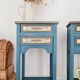 Blue wooden bedside tables with floral patterns