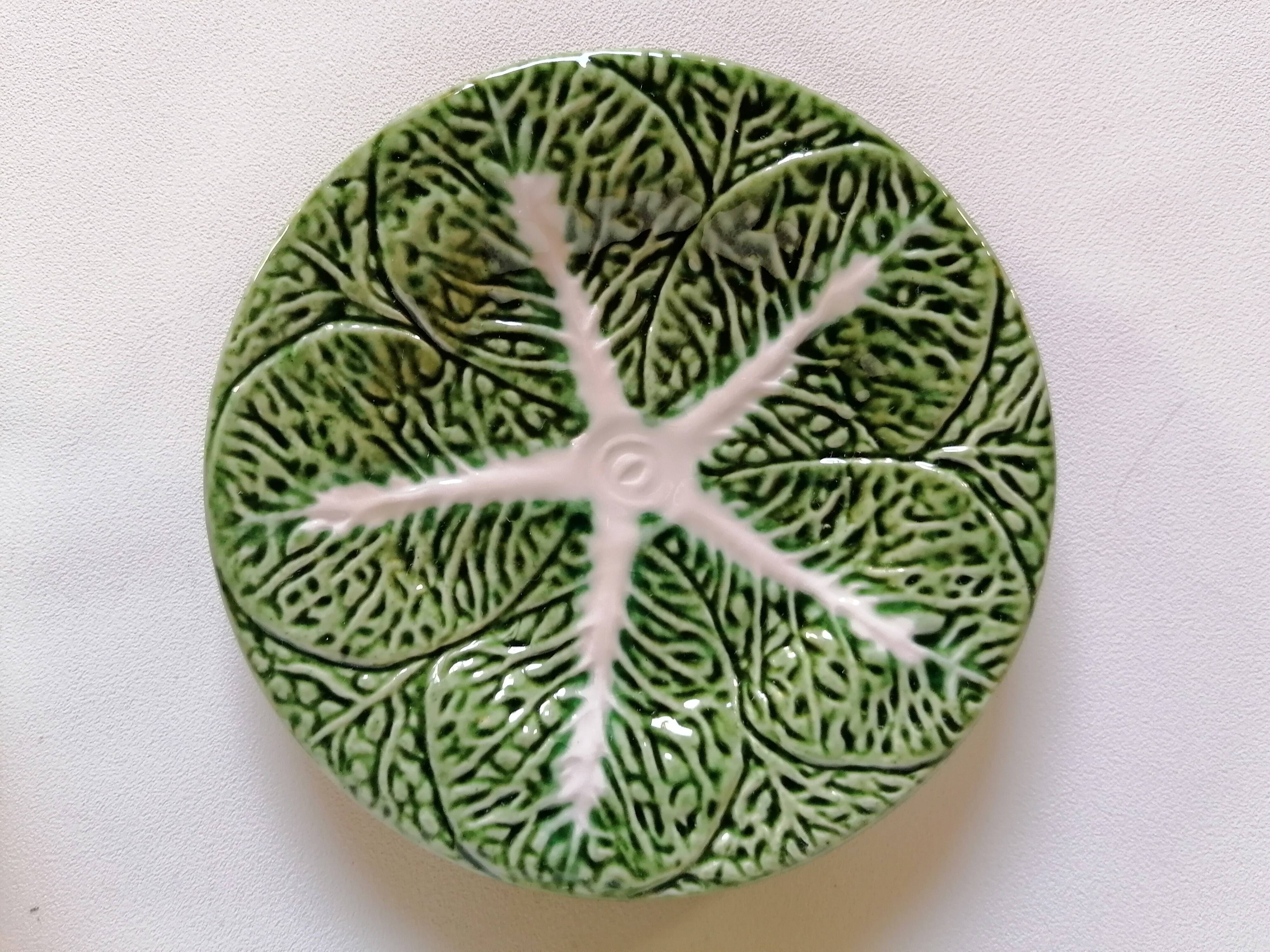 Lot bowls and plates in dabbling cabbage leaves