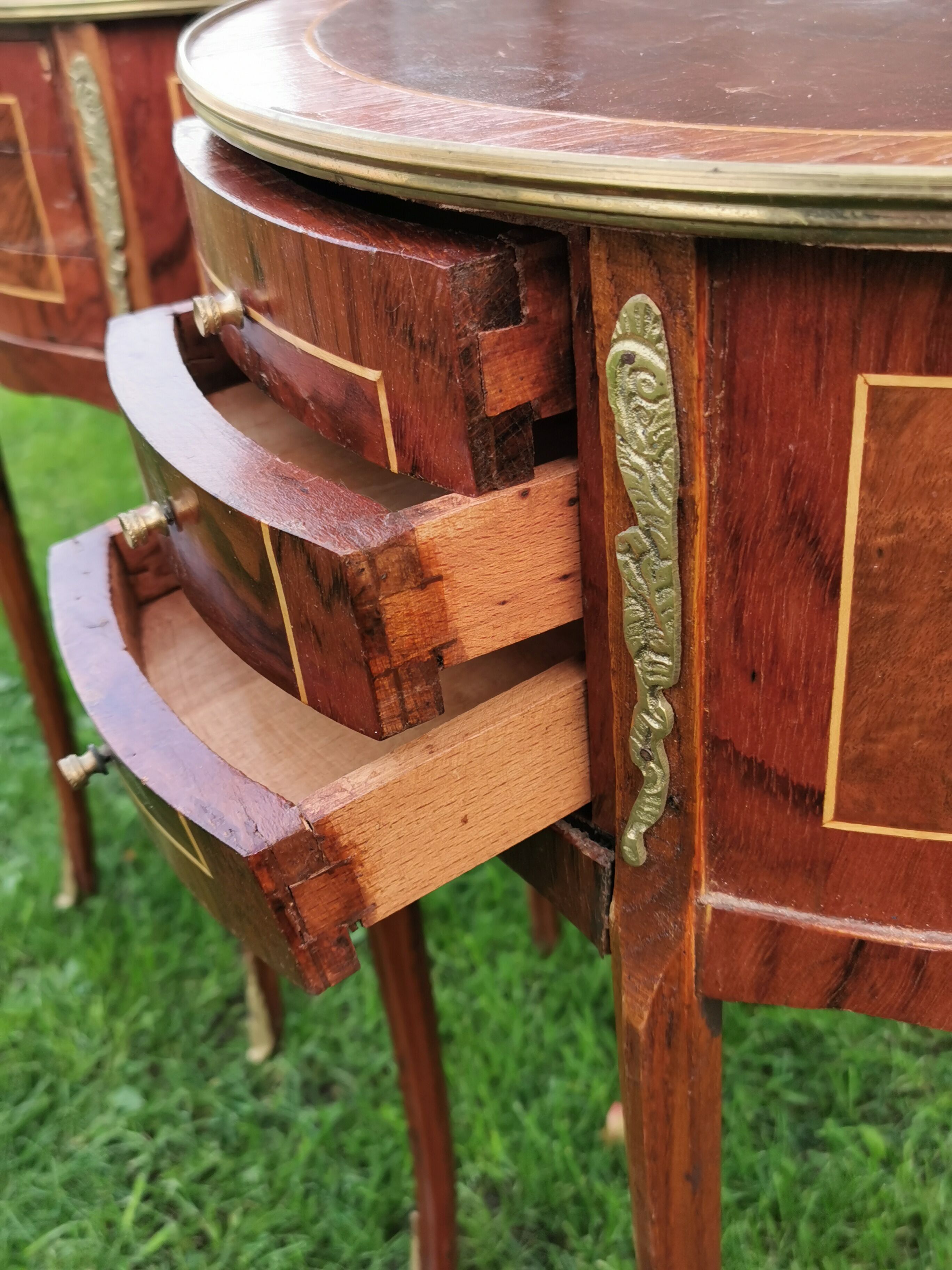 half-moon bedside pair in marquetry, bronze ornaments