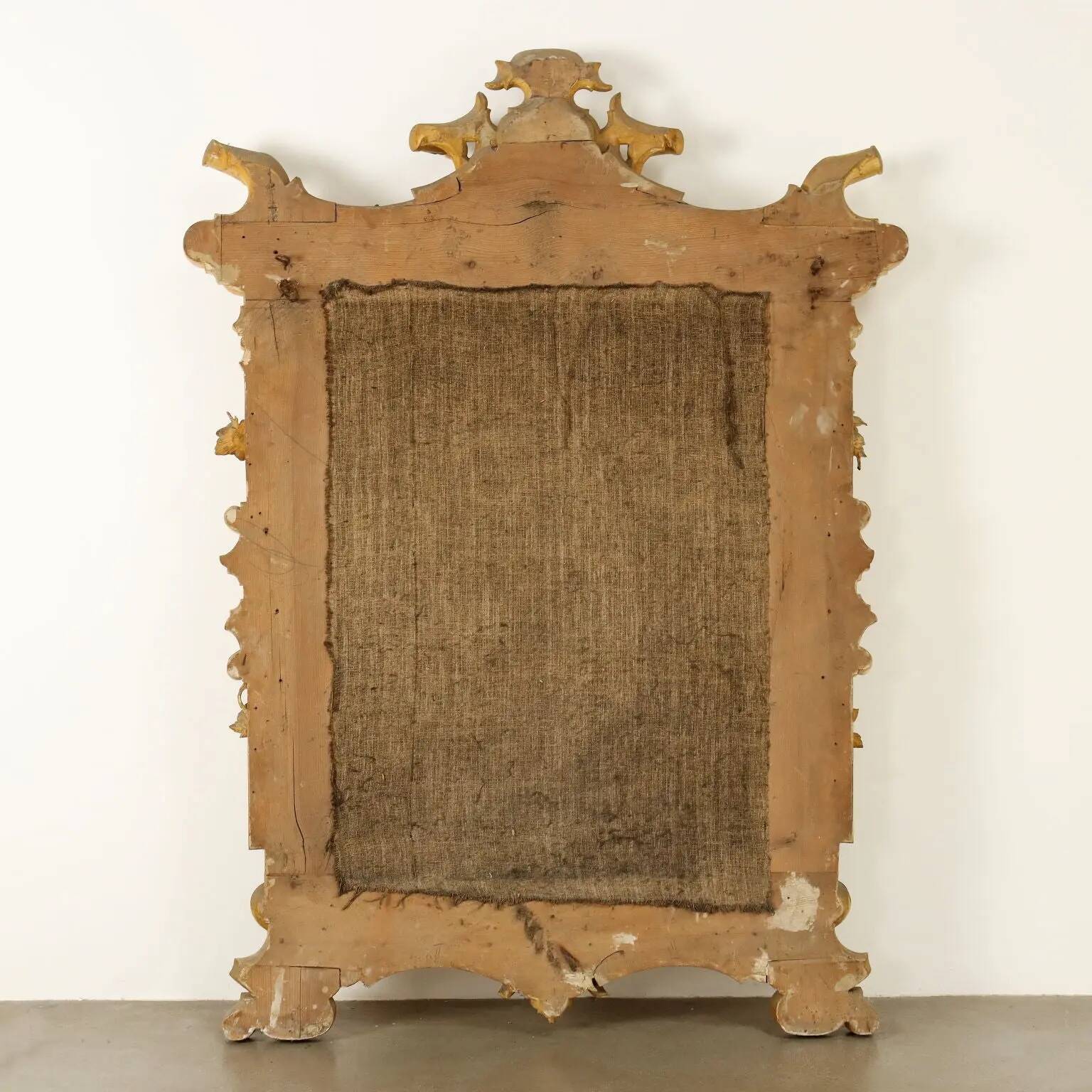 Large antique umber pine mirror from Switzerland, Italy, 19th century.
