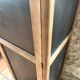 Vintage wooden wardrobe with matte cast iron color hanging rail