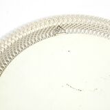 Mid Century Modern round wall mirror with a white expanded metal frame