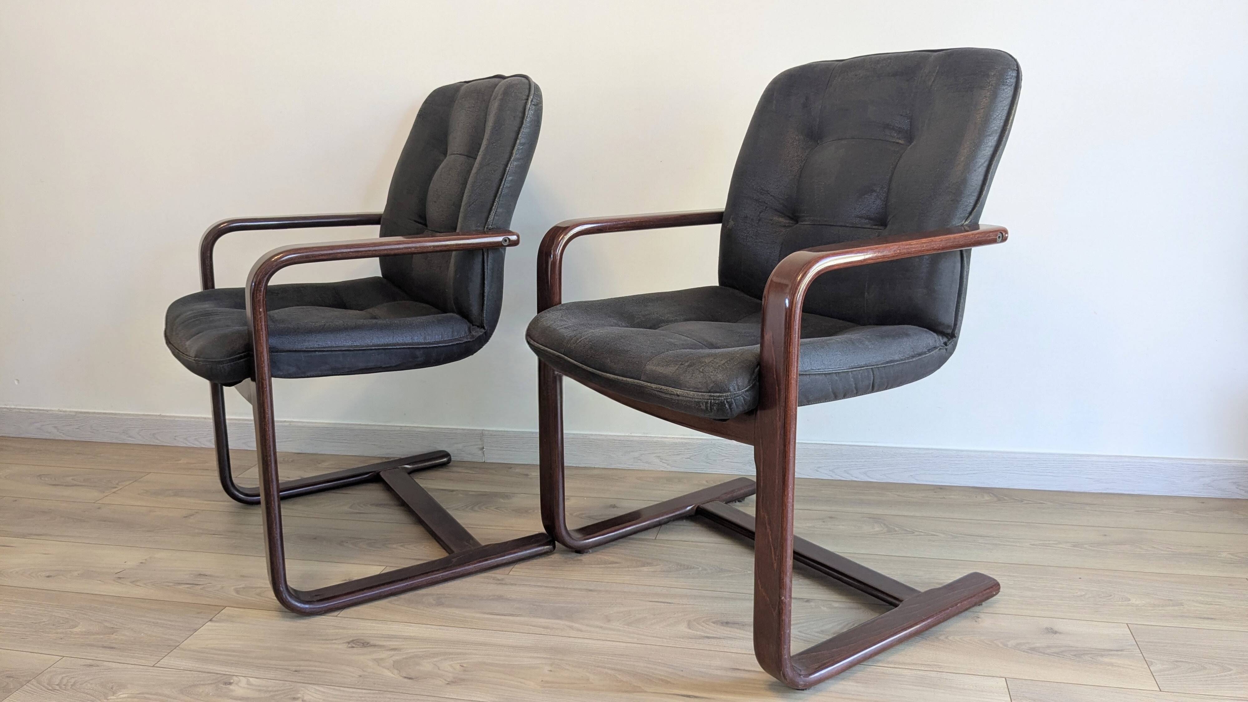 Pair of vintage cantilever armchairs in rosewood veneer.