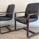 Pair of vintage cantilever armchairs in rosewood veneer.