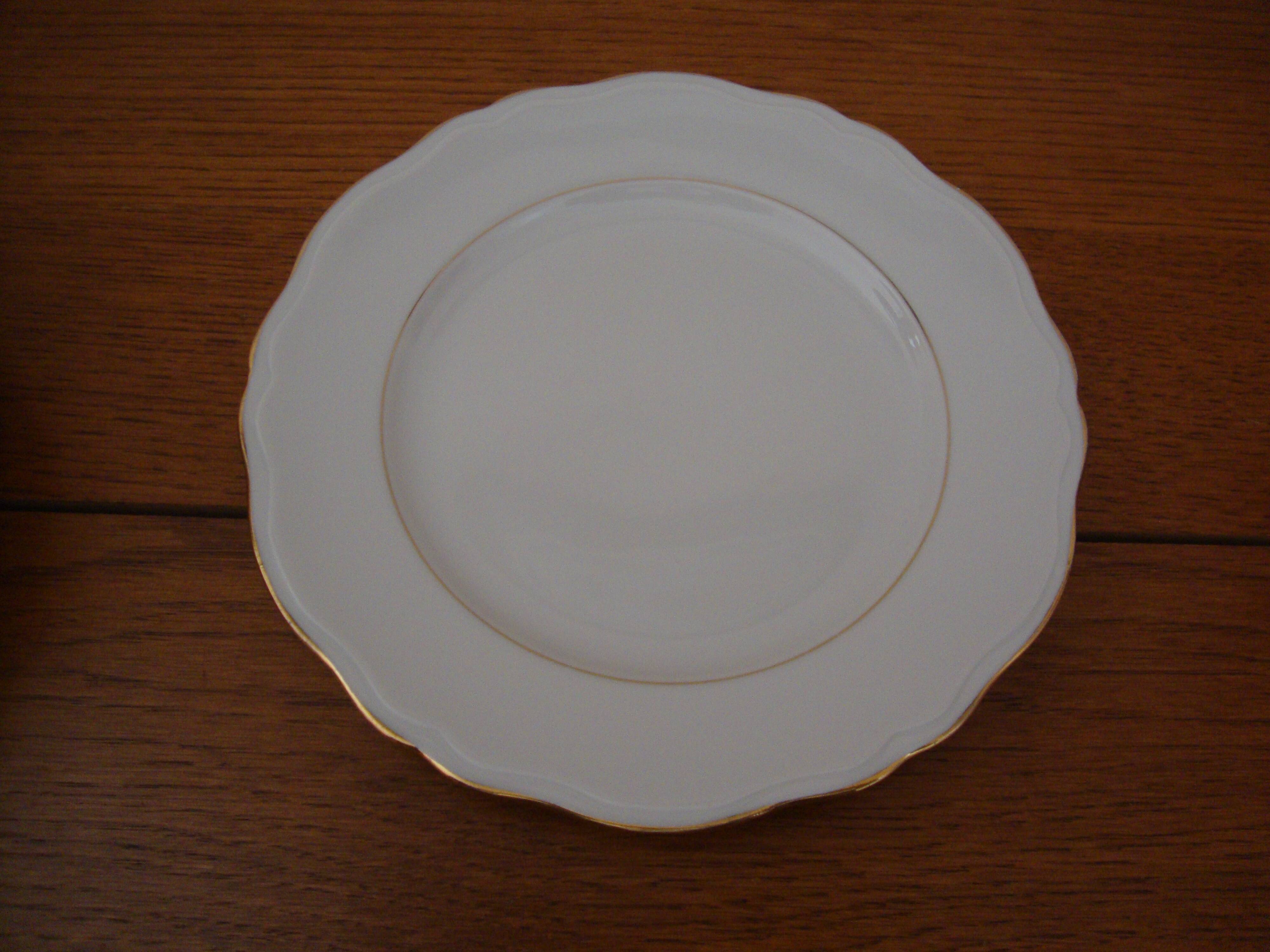 6 fine white porcelain dessert plates (signed Ph. Deshoulières) with festooned golden edges