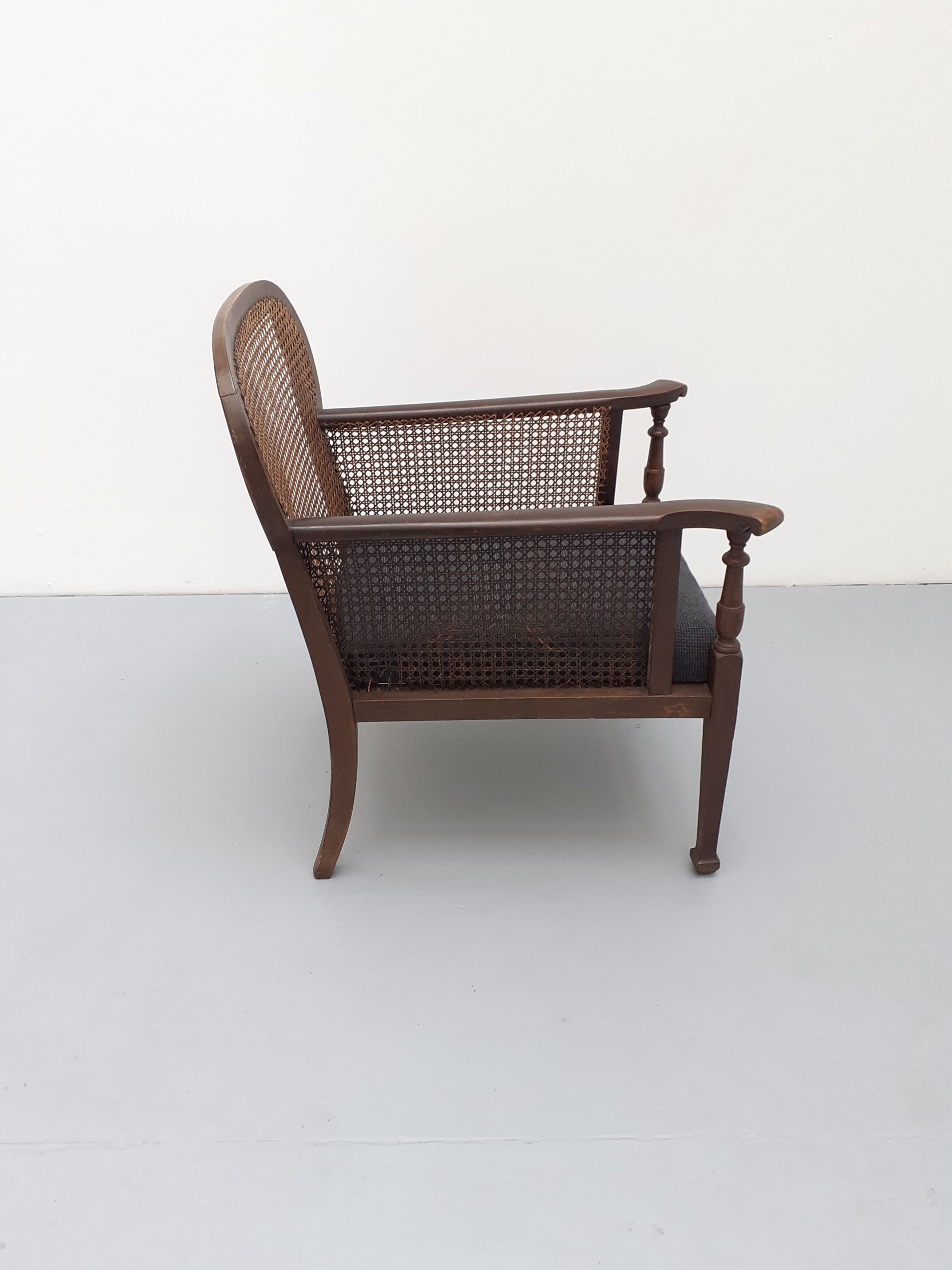 Colonial wooden armchair and cannage