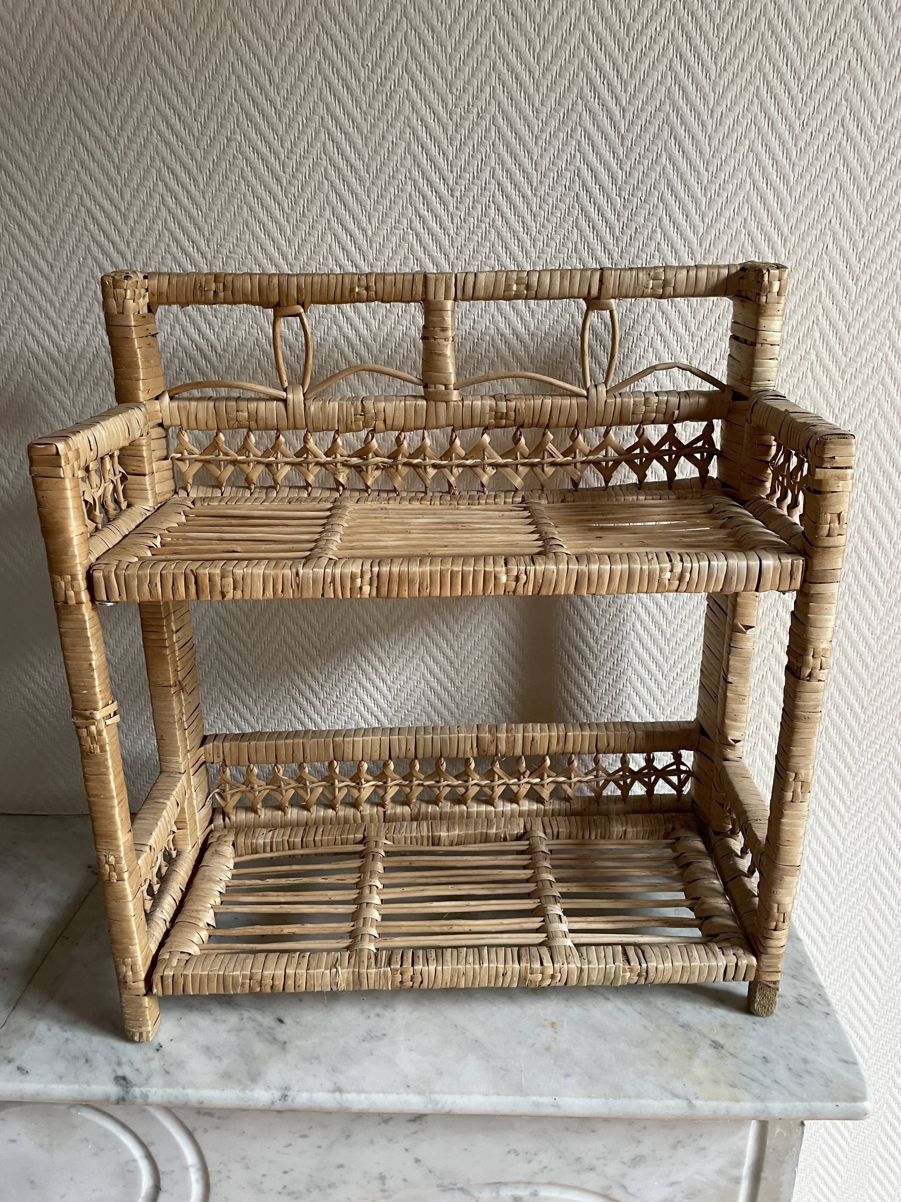 Small light beige wicker and rattan shelf