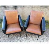 Paire de fauteuils en simili cuir