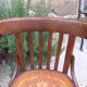 4 bentwood bistro chairs with a pattern on the seat