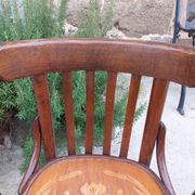 4 bentwood bistro chairs with a pattern on the seat