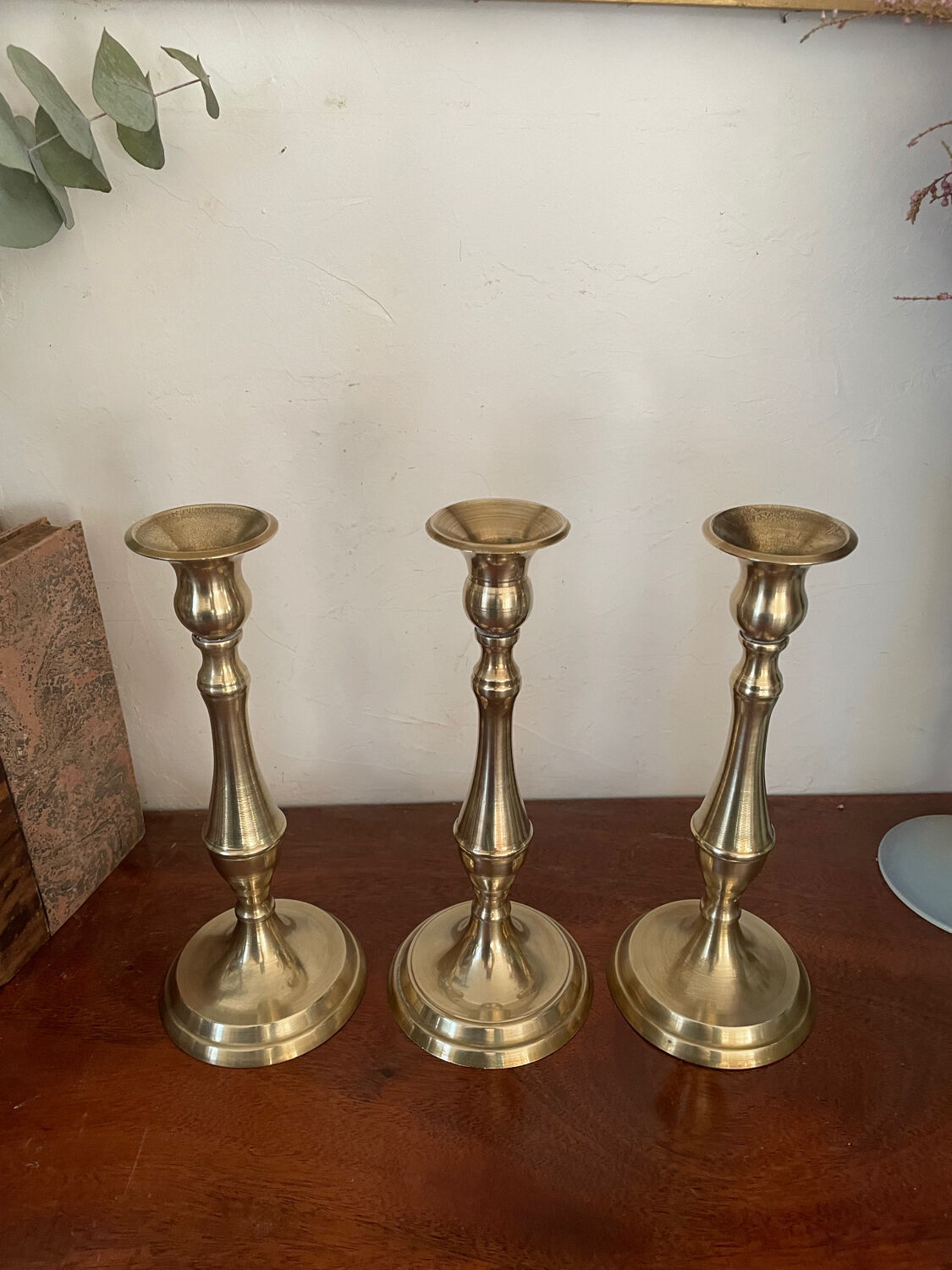 Set of three vintage brass candlesticks