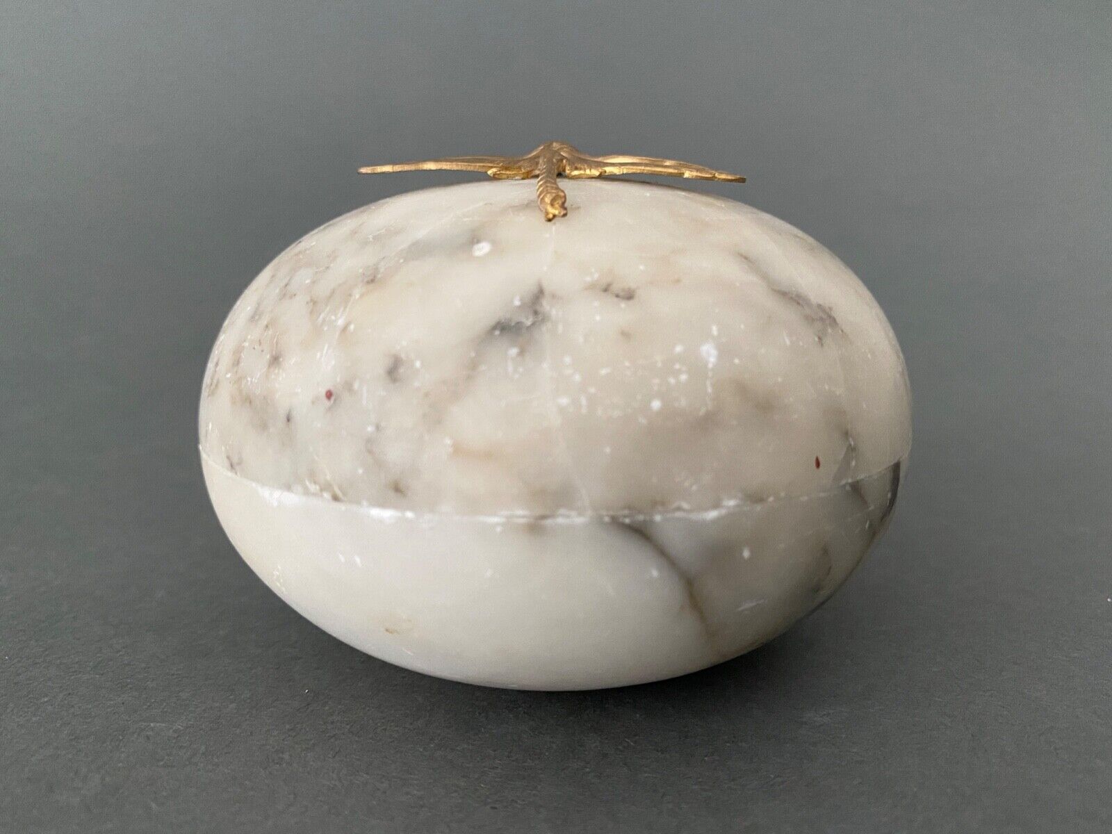 1900 alabaster ball shaped box surmounted by a golden dragonfly