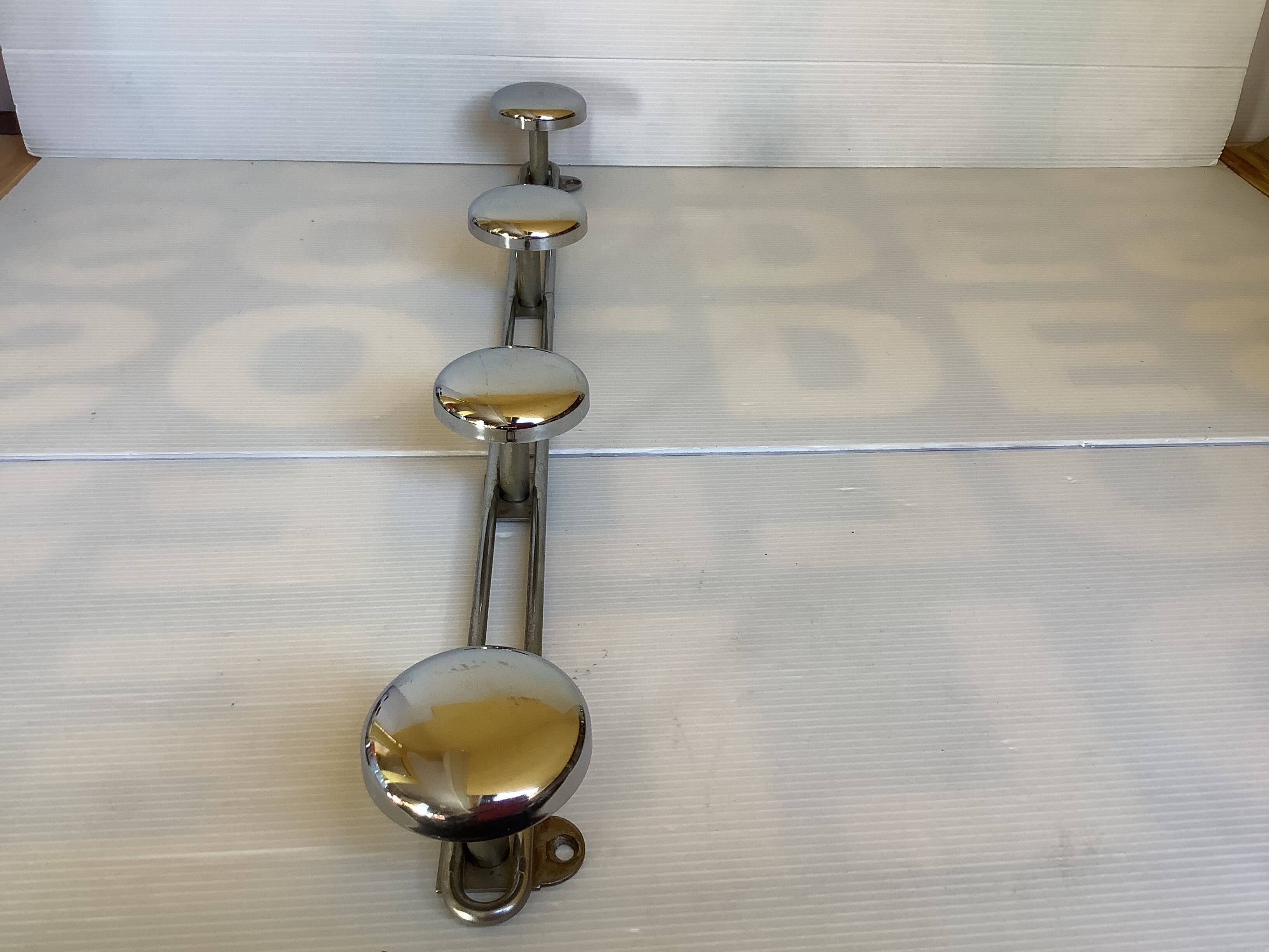 Chromed metal coat rack with four hooks