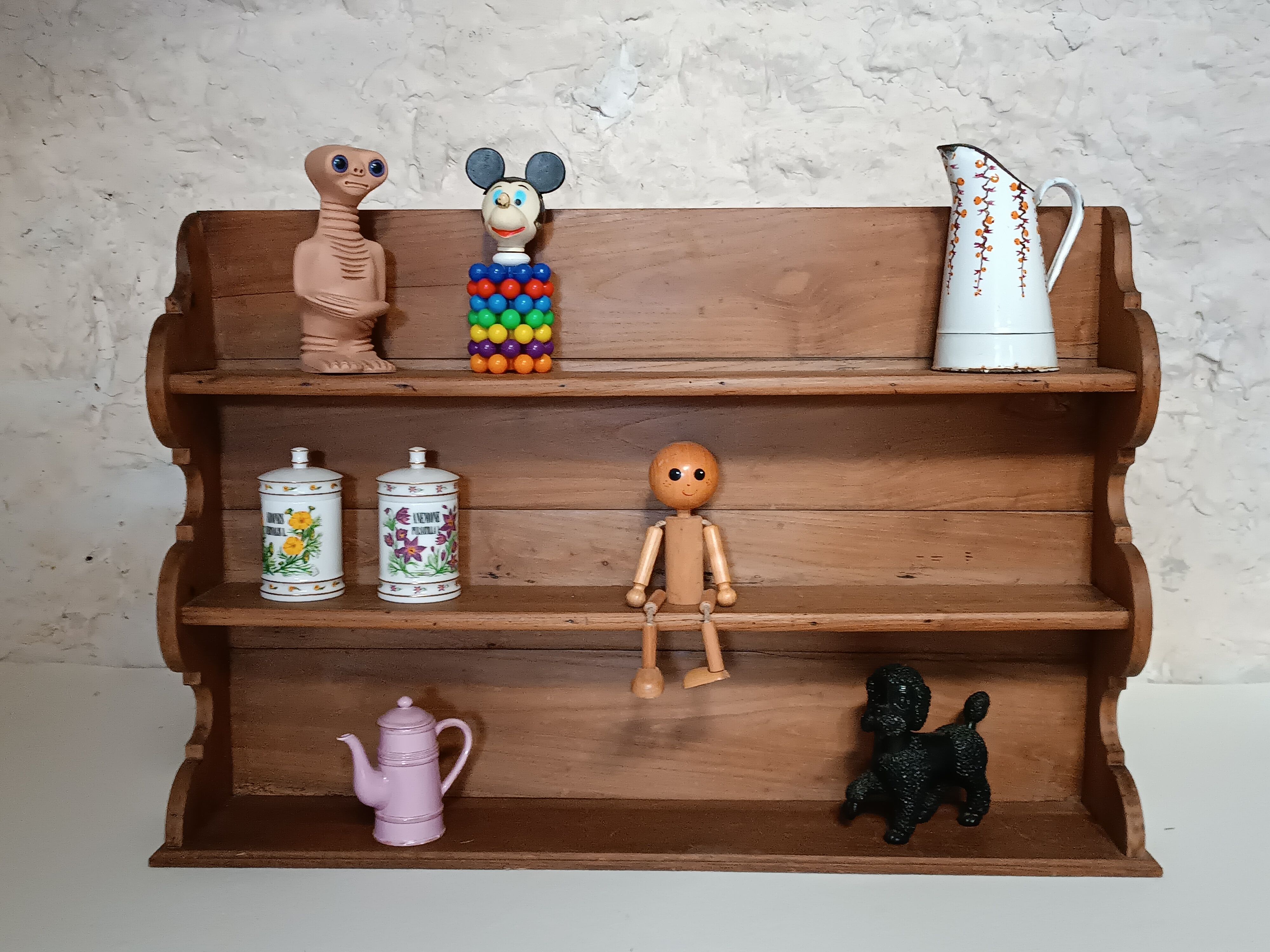 Old wall shelf in raw wood