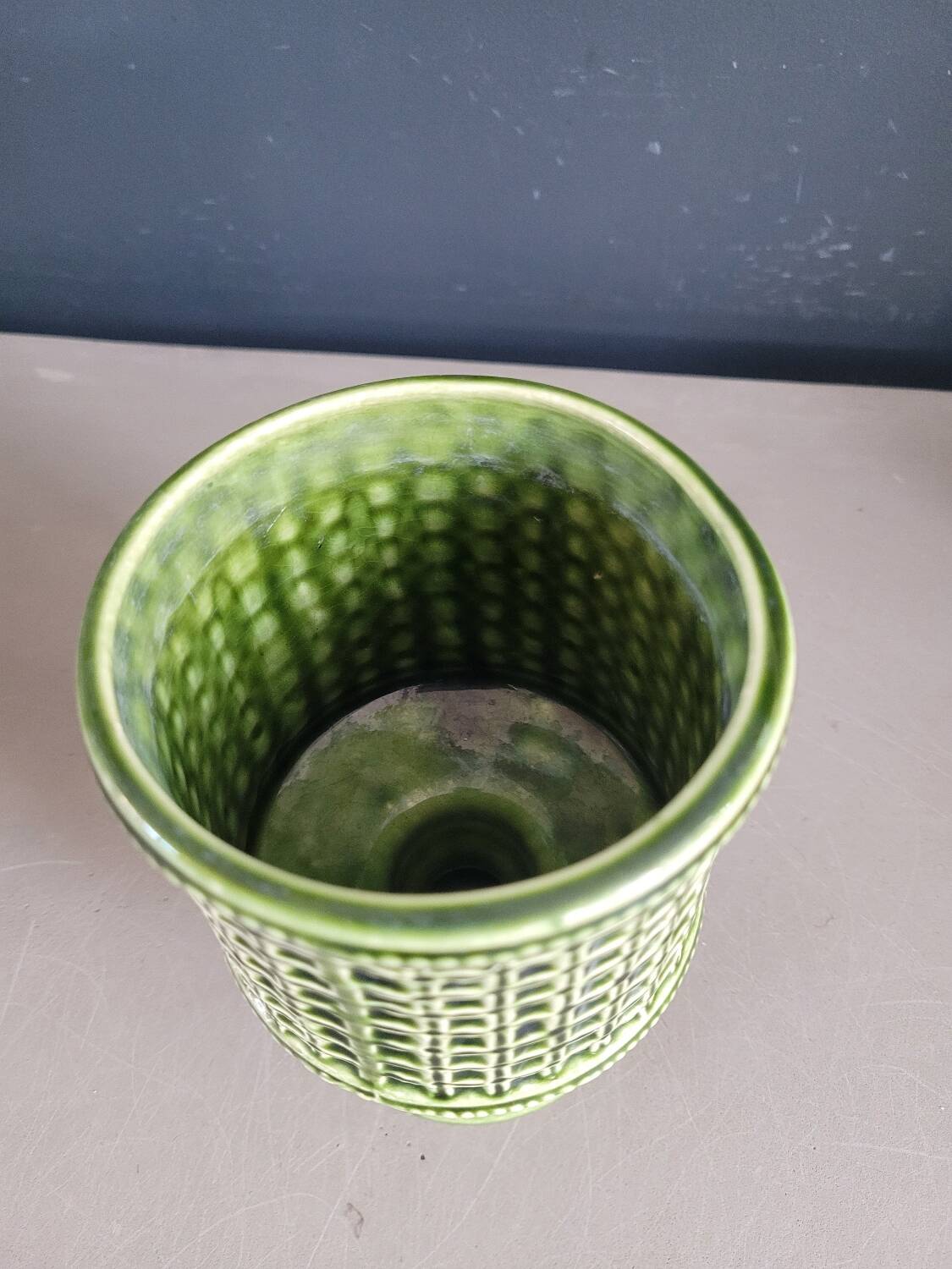 Green glazed ceramic flowerpot on stand
