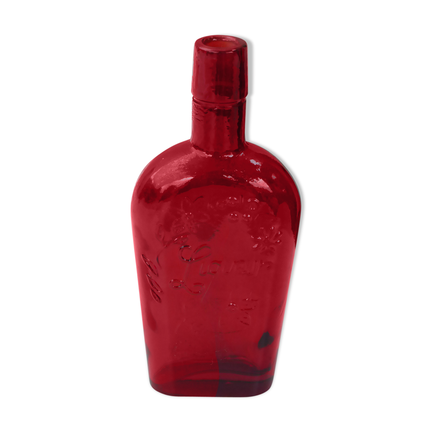 Glass bottle with red glass liqueur, old