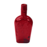 Glass bottle with red glass liqueur, old