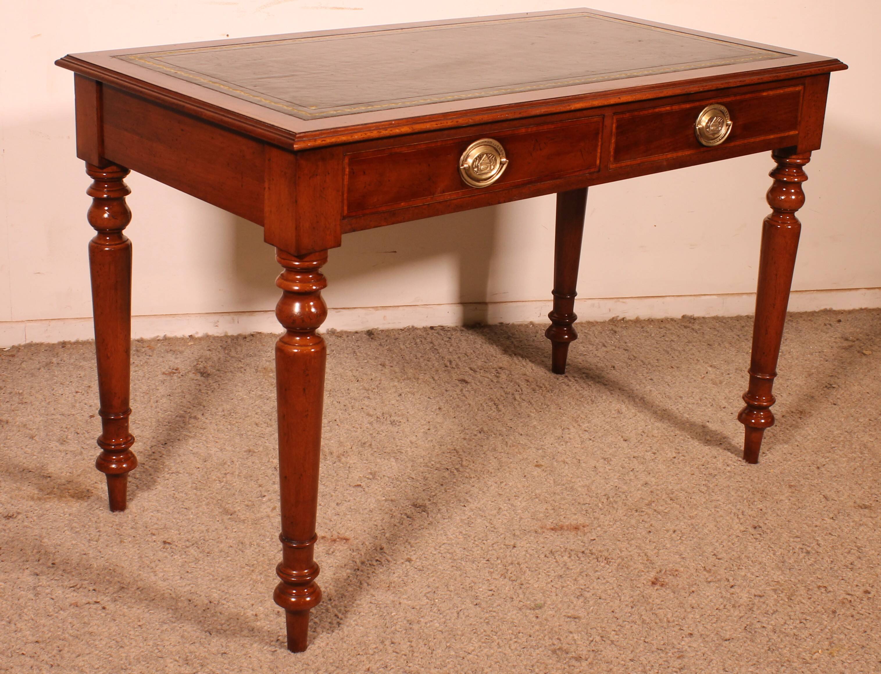 flat desk with two drawers from the 19th century in mahogany and inlays