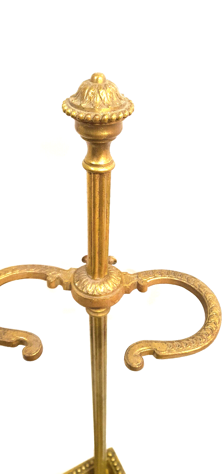 Old brass umbrella door triangular base mounted on column