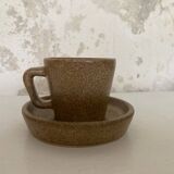 Set of stoneware coffee cups with saucers