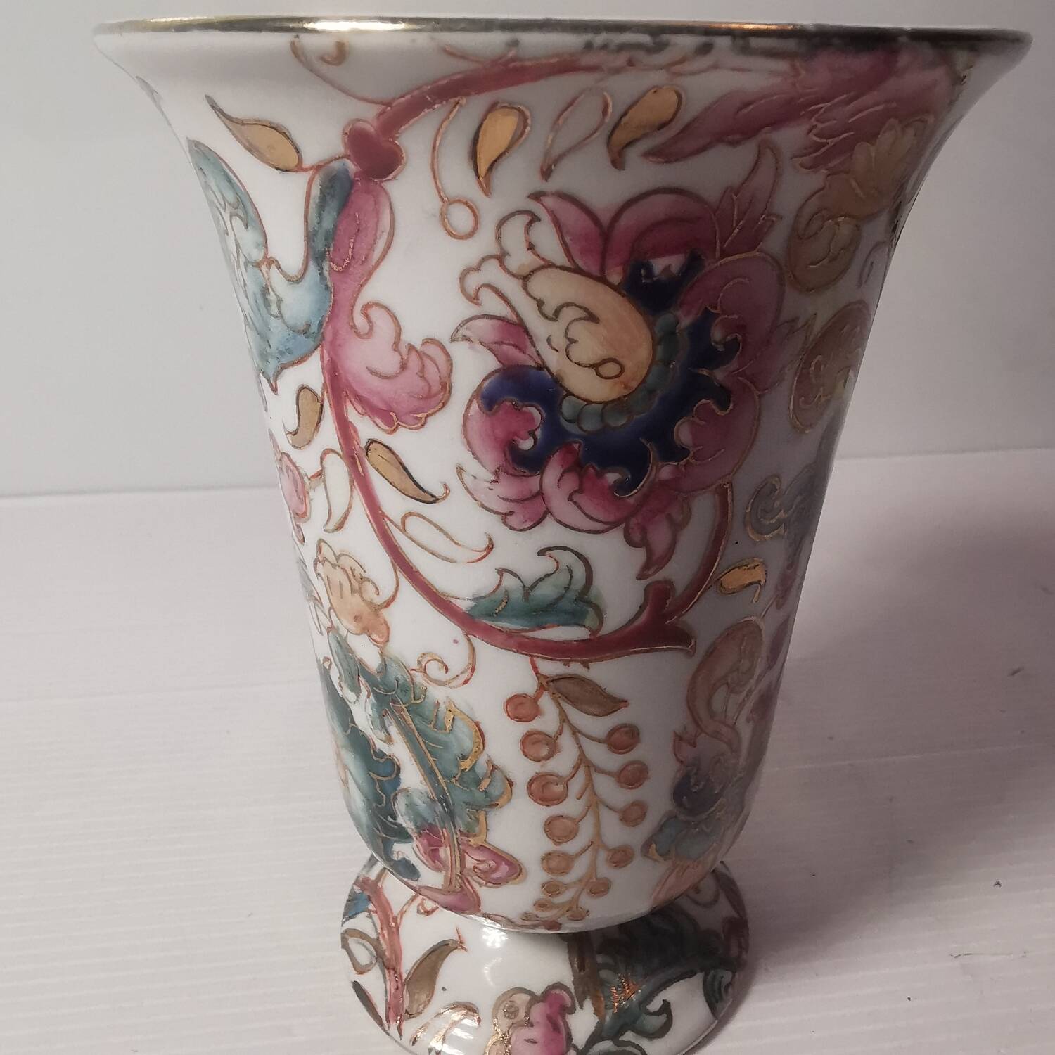 Old vintage vase with floral decor