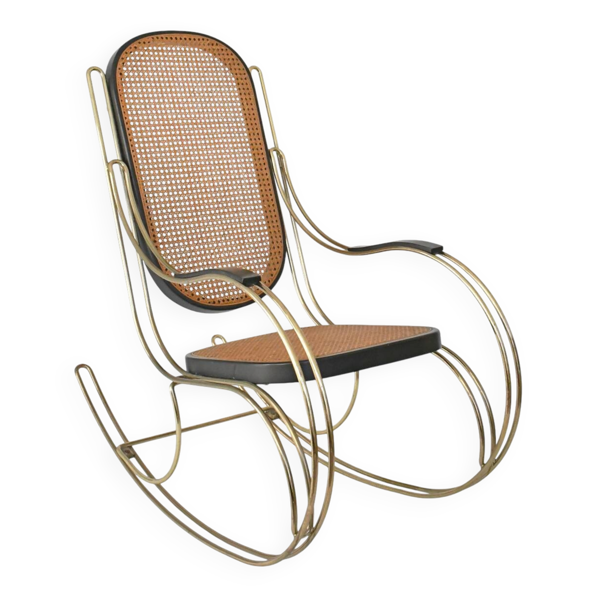 Modernist rocking chair in gilded brass and cane.