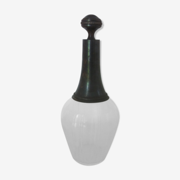 Old carafe with peddling cap