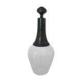 Old carafe with peddling cap