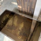 Coffee table with chrome base and mirrored glass top, vintage solar flare decor