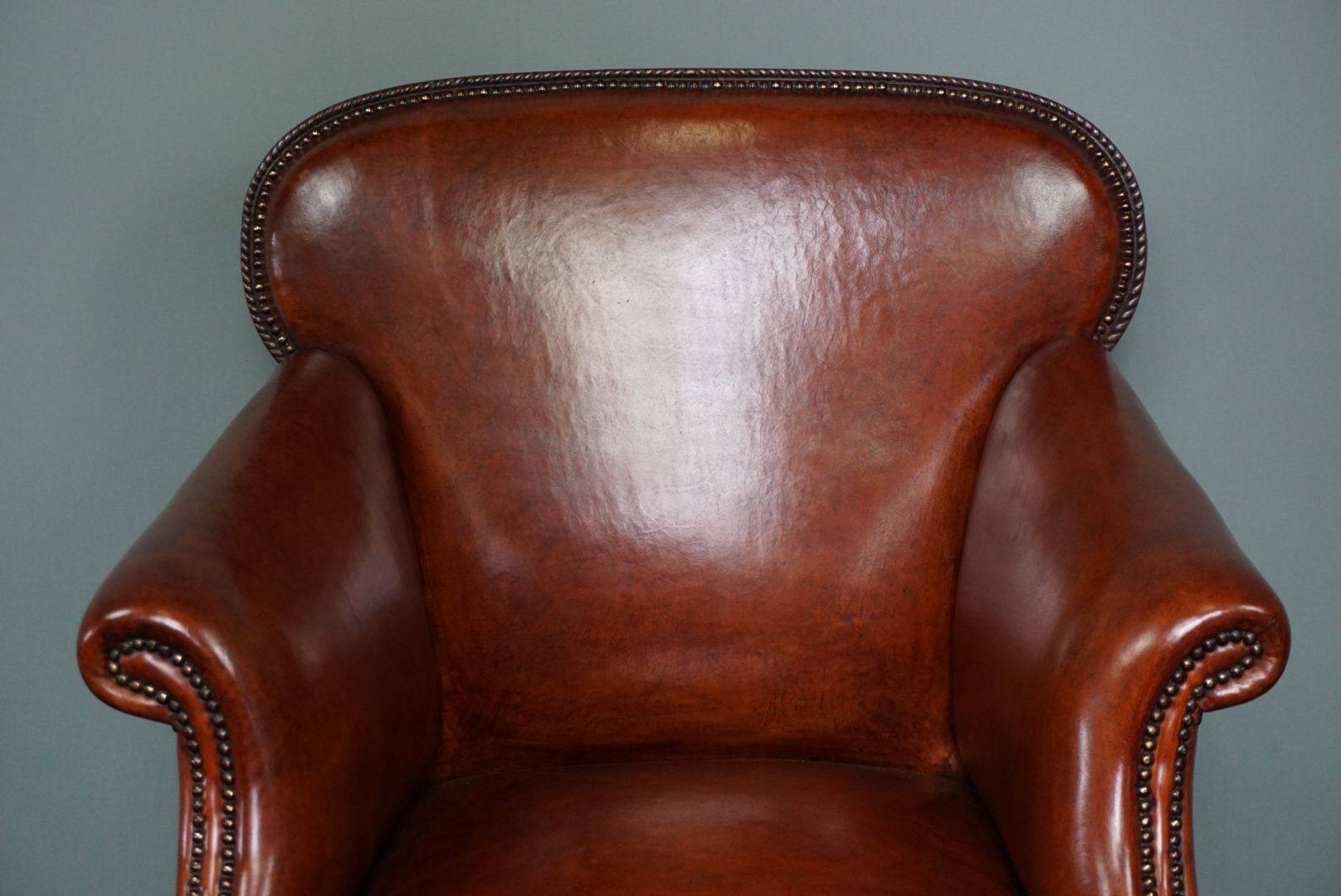 Old armchair in sheep leather