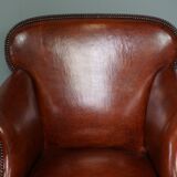 Old armchair in sheep leather