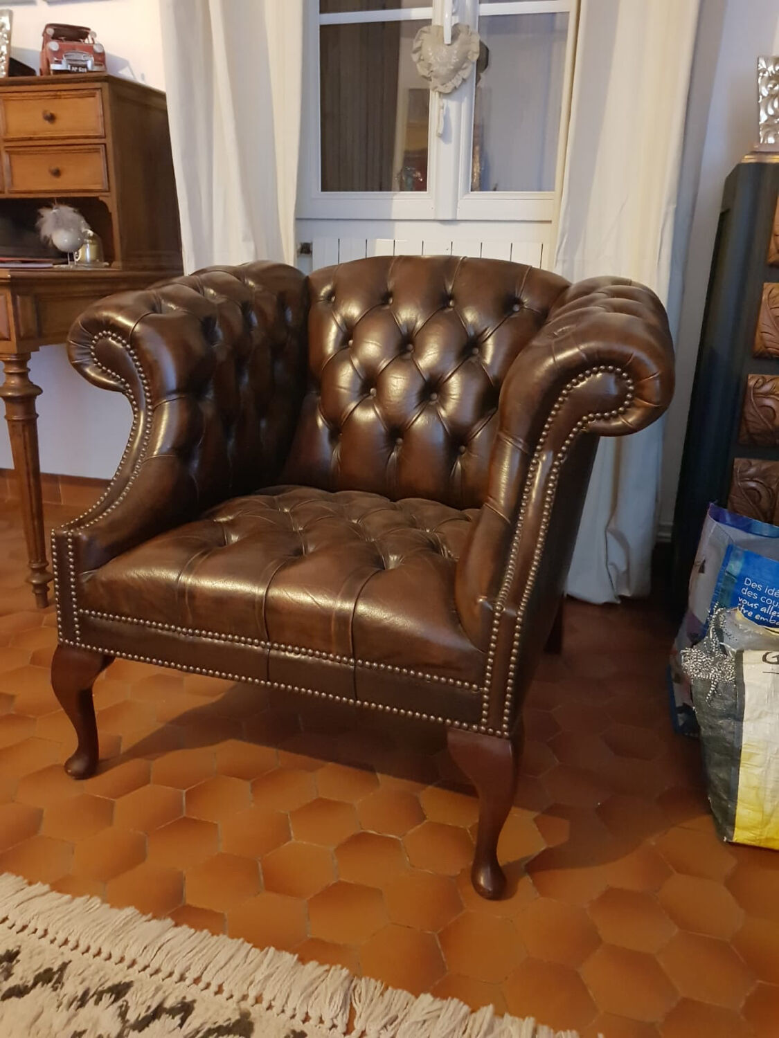 Pair of leather Chesterfield armchairs