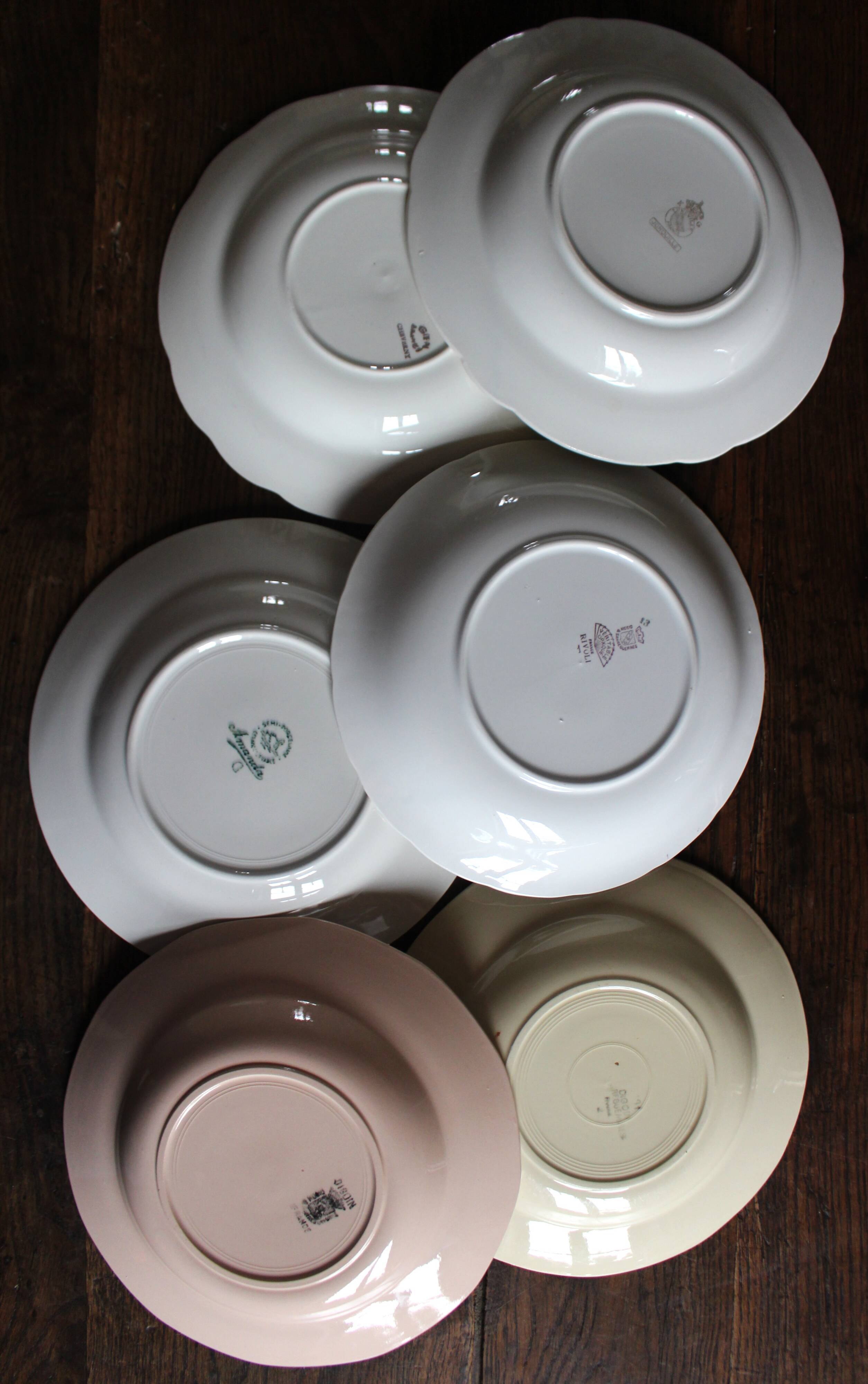 6 mismatched deep plates in floral colours from Digoin, Sarreguemines, Gien.