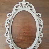 Oval frame molding patinated plant decoration