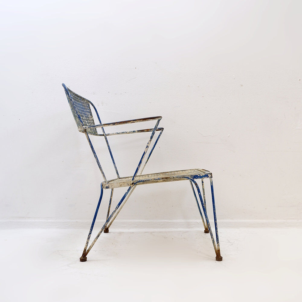 Vintage perforated metal armchair from the 1950s.