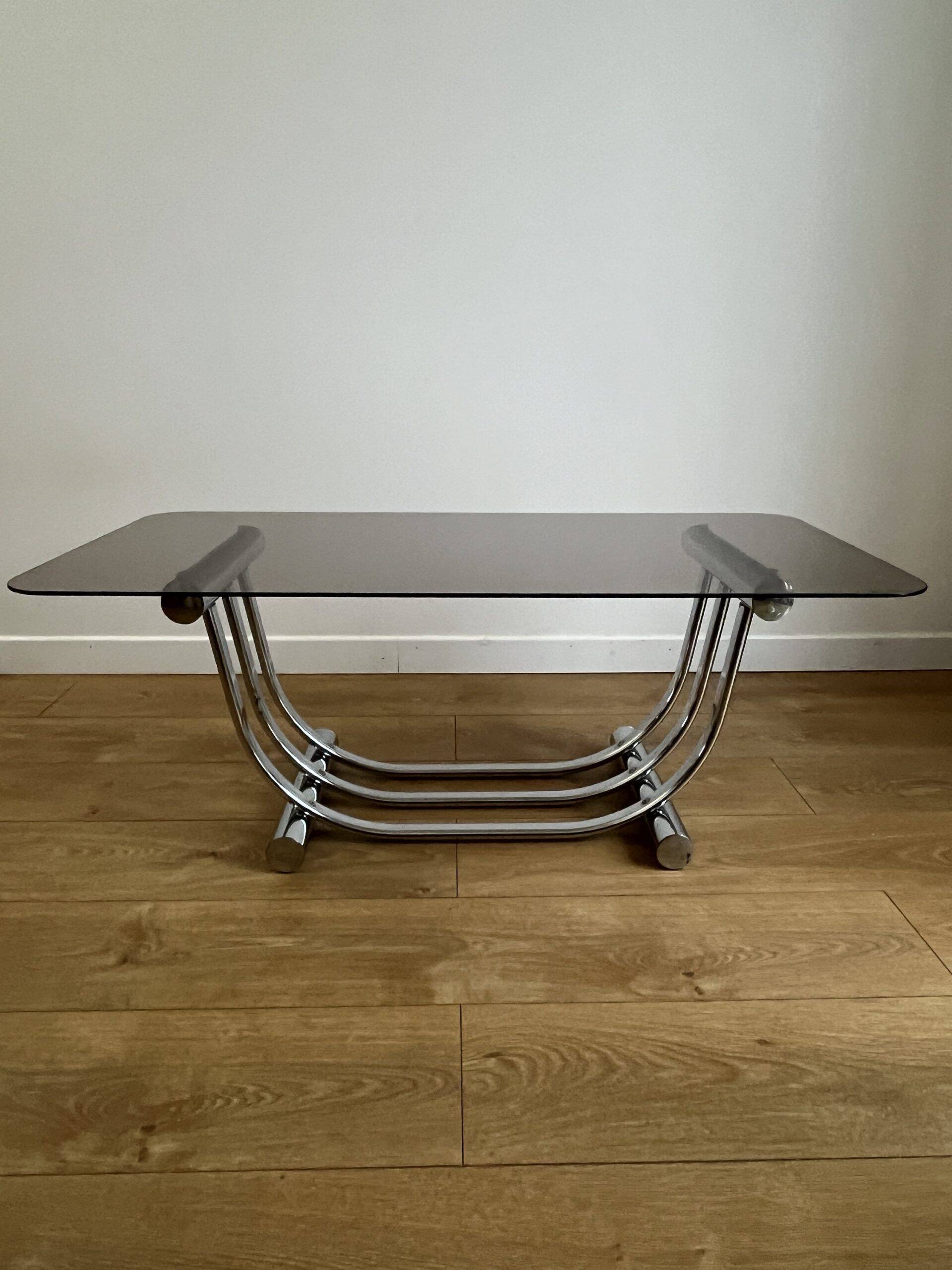 Smoked glass coffee table and chrome base by Yves Boutboul