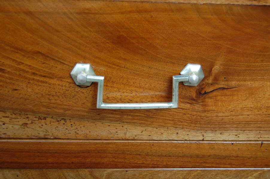 18th-century Louis XVI low walnut commode.