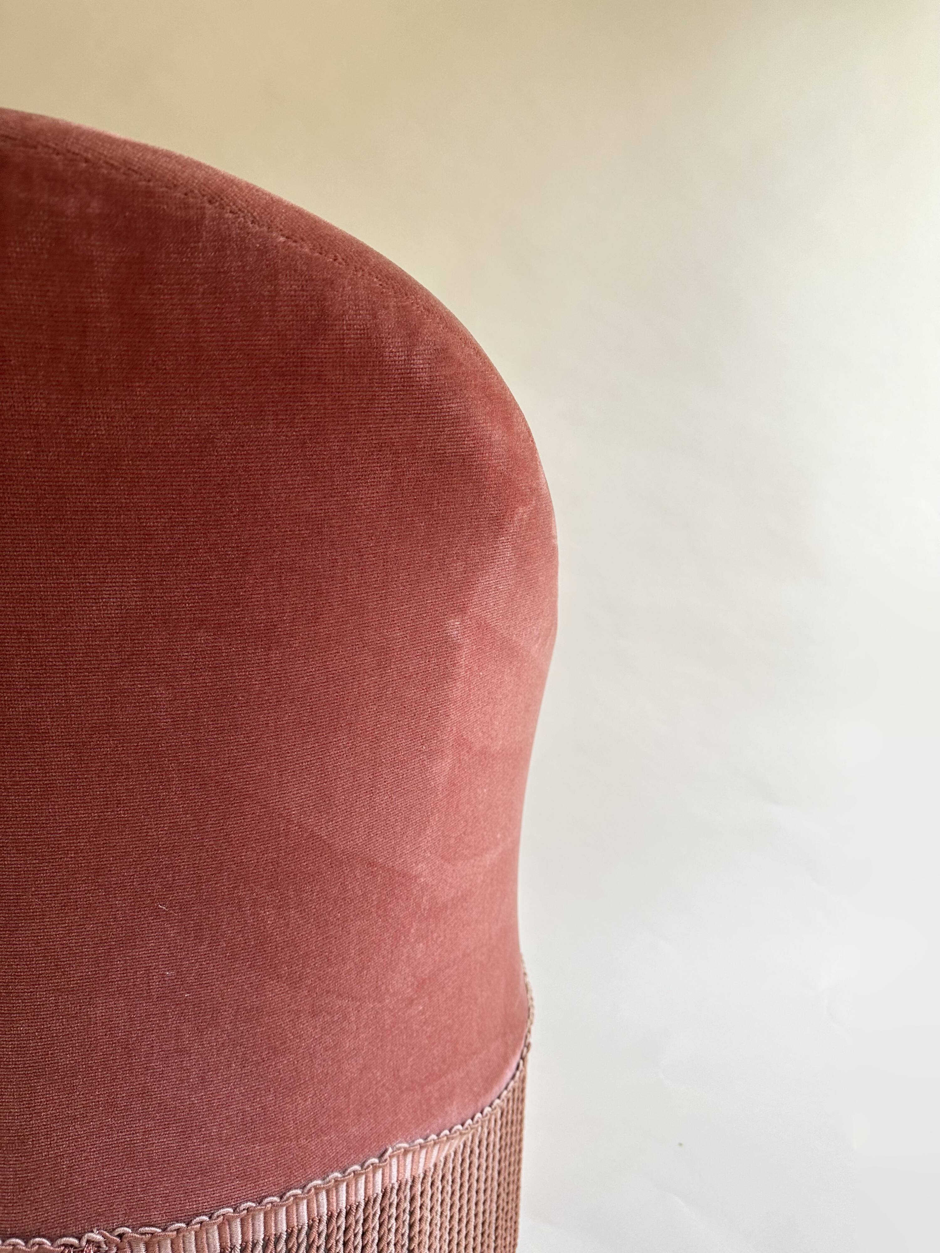 Pink-orange velvet tub chair