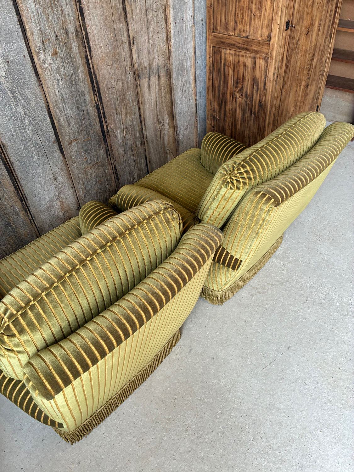 Pair of green recliner chairs