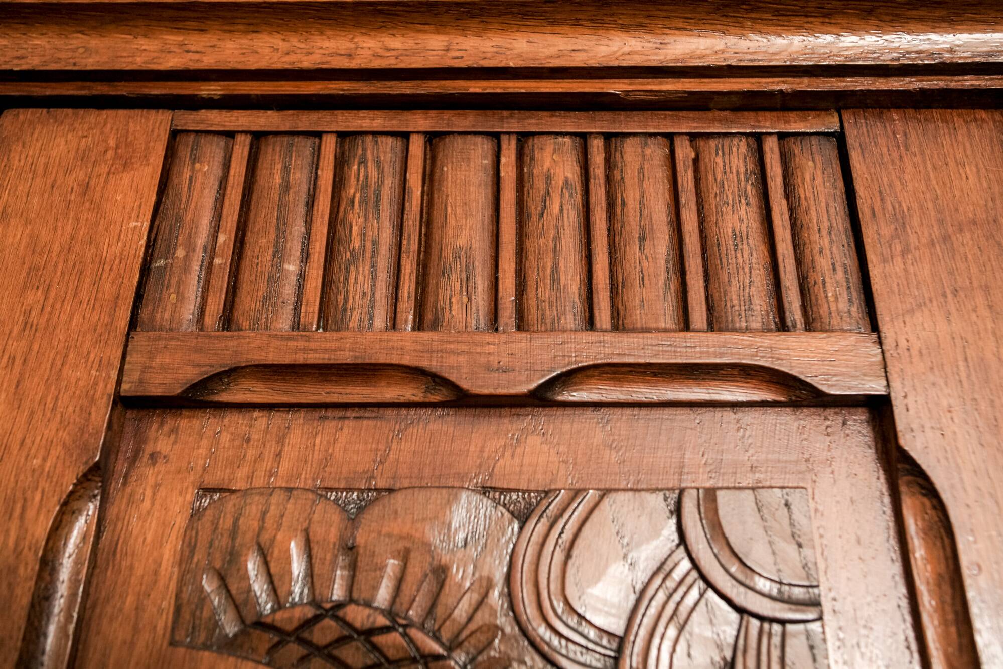 Old solid wood wardrobe with three vintage mirror doors
